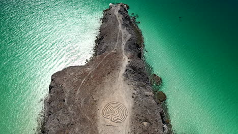 Aerial-View-Of-Rocky-Beach-With-Labyrinth-Near-Playa-Balandra-In-Baja-California-Sur-In-Mexico