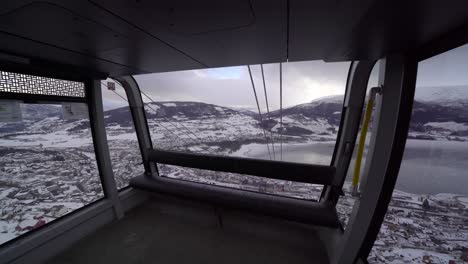 Showing-inside-cabin-of-europes-biggest-Gondola-lift-,-Voss-Gondol---Moving-from-window-revealing-whole-cabin-with-panoramic-view