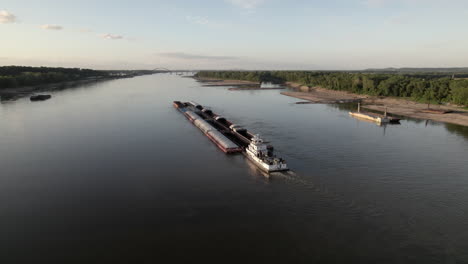 Aerial-parallax-around-back-of-river-barge-during-sunset