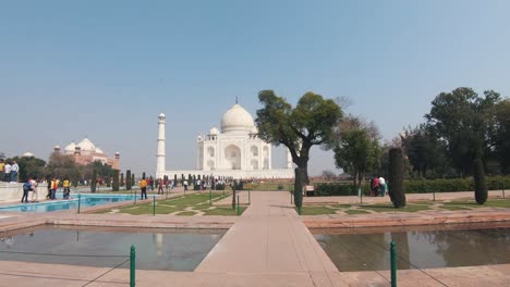 Walkways-beside-reflecting-pool-in-the-center-of-the-Charbagh-Garden-in-Taj-Mahal-exterior---Wide-push-in-dolly-shot