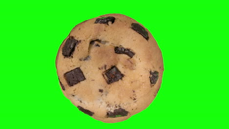 Large-Chocolate-Chip-Cookie-Turning-On-Green-Background