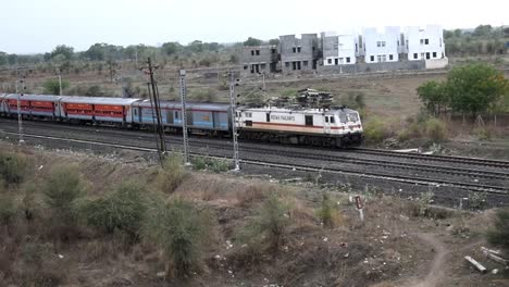 Indian-Passenger-Train-Passing-Through-Midway-of-Forest-Located-in-India