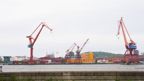 Scenic-View-Of-The-Famous-Big-Cranes-Of-Gothenburg-In-Sweden-At-Daytime