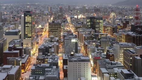 Stunning-dusk-to-night-time-lapse-high-above-snowy-Sapporo-City-in-Japan