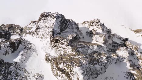 Top-down-breathtaking-aerial-pov-over-Cima-d'Asta-peak-of-Dolomite-mountains-with-snow