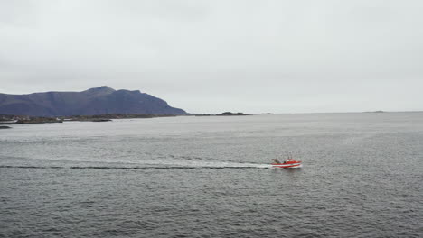 Small-Boat-Sailing-Across-The-Atlantic-Ocean-In-Averoy,-Norway-On-A-Cloudy-Day