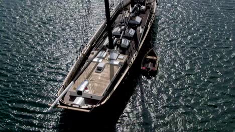 Close-up-view-of-a-stunning-mast-wooden-ship-anchored-in-the-water