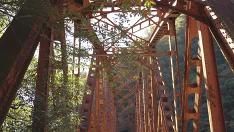 Fukuchiyama-Abandoned-Railway-Hike,-Red-Iron-Bridge-at-Sunrise,-Japan