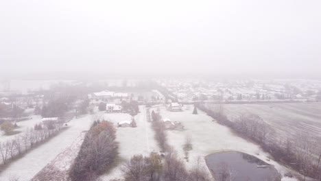 Aerial-view-of-an-Snowy-Countryside,-Southeast-Michigan-residential-area-during-a-rare-snow-storm