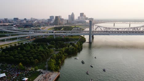 Aerial-view-of-a-art-festival,-at-the-waterfront-park-of-Louisville,-USA---pan,-drone-shot