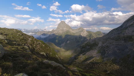 Midi-d'ossau-peak-and-sea-of-clouds-in-the-valley-during-summer-sunset-timelapse