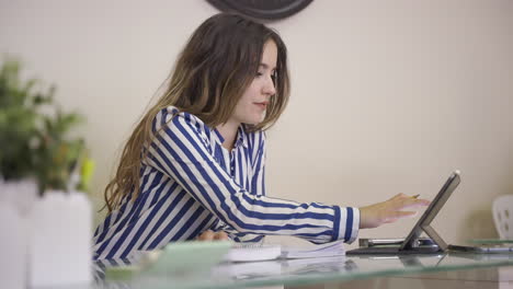 Young-woman-working-at-home-office