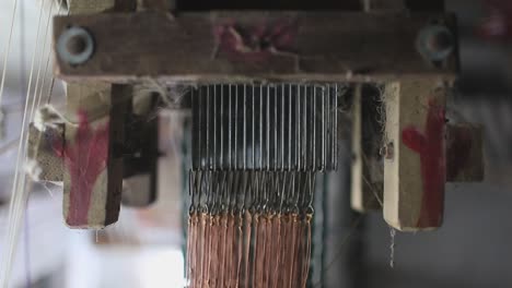 Close-up-view-of-the-wooden-machine-used-for-weaving-in-Sri-Lankan-village-for-making-and-stitching-mats-or-clothes