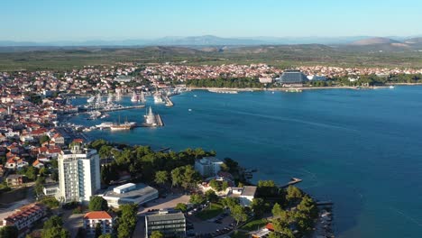 Touristic-Resorts-In-Town-Of-Vodice,-Amazing-Turquoise-Coastline-On-Adriatic-Coast-In-Croatia---aerial-drone-shot