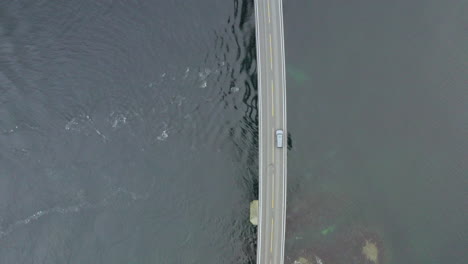 View-Of-Vehicle-Crossing-Storseisund-Bridge-in-Atlantic-Ocean-Road,-Norway