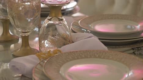 Wedding-Reception-Table-With-Porcelain-Plates,-Silverware,-And-Etched-Glasses