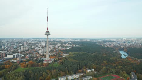 AERIAL:-Vilnius-TV-Tower-on-a-Autumn-Season-with-City-and-River-Neris-in-Background
