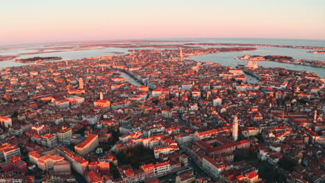 Wide-circling-drone-shot-over-Venice-city-in-the-late-sunset-light