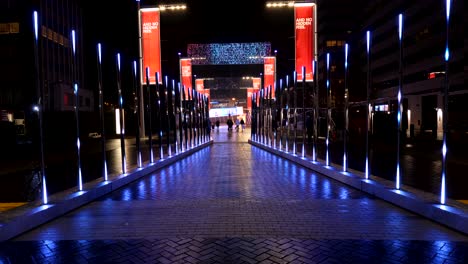 Glowing-alley-of-Christmas-lights-in-Winterfest-London-city,-static-view