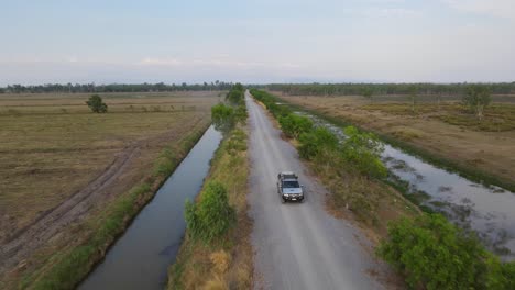 Aerial-steady-footage-and-then-reverses-to-follow-the-truck,-Pak-Pli,-Nakorn-Nayok,-Thailand