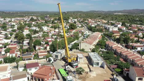 Birds-eye-view-over-modular-homes-being-installed-on-a-warm-summers-day