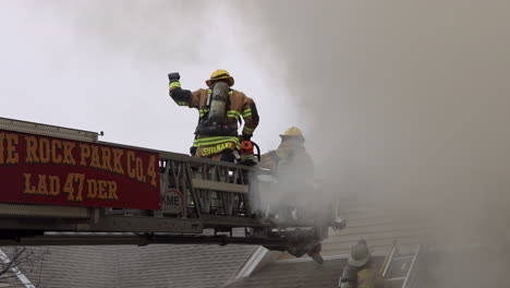 A-Team-of-Firefighters-Use-Ladders-to-Head-into-Thick,-Dark-Smoke-Coming-from-a-Burning-House