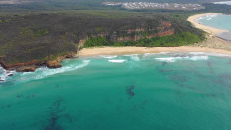 Beautiful-sandy-coastline-and-turquoise-waters-of-Moonee-Beach-near-Coffs-Harbour,-New-South-Wales,-Australia
