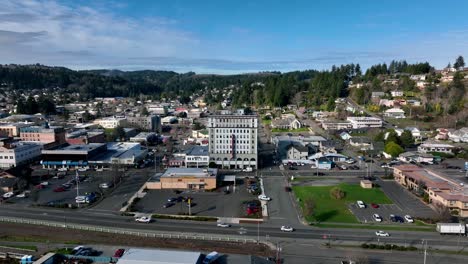 This-is-a-frontal-shot-from-the-Isthmus-Slough-in-Coos-Bay,-Oregon-flyover-to-and-above-the-Tioga-Building,-shot-with-a-Mavic-3-drone
