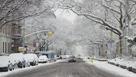 Cars-Move-Slowly-Down-Avenue-In-New-York-City-During-Snowfall