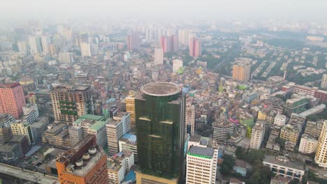 Aerial-Circle-Dolly-Over-Hazy-Morning-Cityscape-In-Asia,-City-Centre