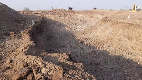 After-digging-construction-land-by-excavator-mechanical-shovel