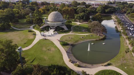 Galileo-Galilei-planetary-in-Tres-de-Febrero-park-and-lake-with-fountain,-Buenos-Aires