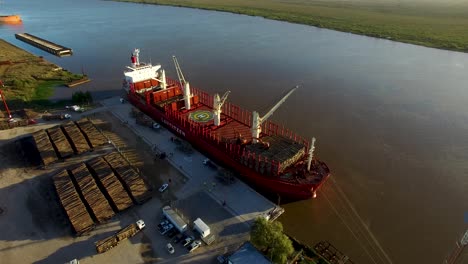 Aerial-View-Of-Lauritzen-Cargo-Vessel-Loading-Piles-Of-Woods-At-The-Port-Of-Buenos-Aires-In-Argentina