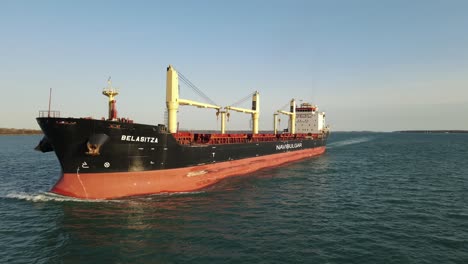 Aerial-dolly-shot-of-Freighter-on-Detroit-River-on-a-calm-sunny-day-in-USA