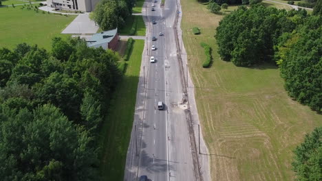 Aerial-View-of-Road-Traffic-in-Suburbia-of-Kaunas,-Lithuania-on-Sunny-Summer-Day,-Drone-Shot