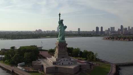 Aerial-view-around-the-Statue-of-Liberty,-in-sunny-New-York,-USA---orbit,-drone-shot
