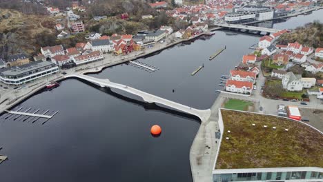 River-Marna-with-unique-Adolph-tiedemans-bridge-crossing-the-calm-water---Aerial-in-Mandal-Norway