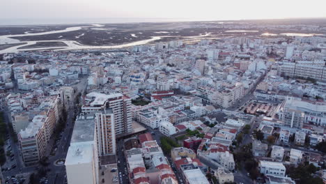 Sunset-Aerial-Pullback-Faro-City-with-Ria-Formosa-Lagoon-in-Background