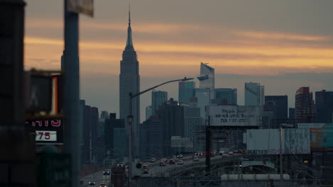 Empire-State-Building-Seen-From-Queens,-New-York,-At-Sunset