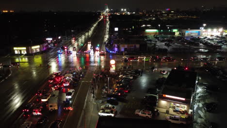 Aerial-circling-shot-of-a-Freedom-convoy-in-Canada-at-night,-protesting-against-Canadian-Government