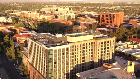 Aerial-drone-orbit-around-modern-hotel-and-campus-buildings-of-University-of-Arizona-in-Tucson
