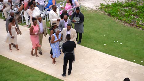 Wedding-guests-enjoy-champagne-toast-after-wedding-celebration