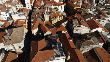 Traditional-Houses-With-Red-Roofs-In-Sibenik,-Croatia---aerial-drone-shot