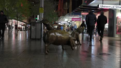 Located-in-Rundle-Mall-Adelaide-South-Australia,-these-life-sized-pigs-look-to-be-having-a-great-day-out-in-Rundle-Mall-as-they-walk-the-Mall,-dig-through-the-bin-for-food-scraps-and-greet-passers-by