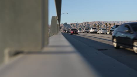 Cars-passing-viaduct-on-Interstate-10-highway,-Colorado-Desert,-California,-USA