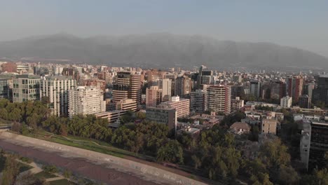 Santiago-Chile-aerial-with-Rio-Mapocho-in-front-and-Andes-in-distance