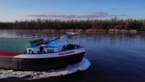 Inland-Sulomaro-Cargo-Ship-With-Intermodal-Containers-Sailing-In-The-River-At-South-Holland,-Netherlands