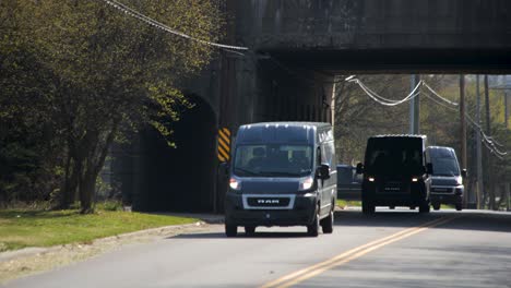 Amazon-vans-or-Amazon-trucks-pull-on-a-city-street