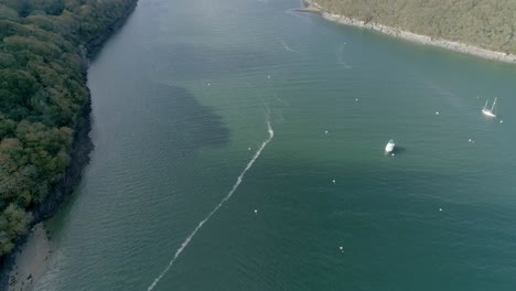 Dramatic-aerial-reveal-over-Helford-River-in-Cornwall,-UK