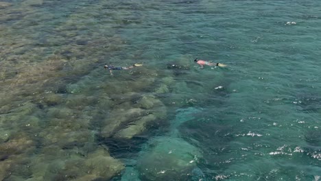 Scuba-divers-near-Falasarna-beach-in-Crete-island,-aerial-view